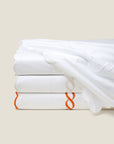 Treccia flat sheet white/white, white/beige and white/orange stack