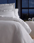Angel Luxe in white bedding corner shot.