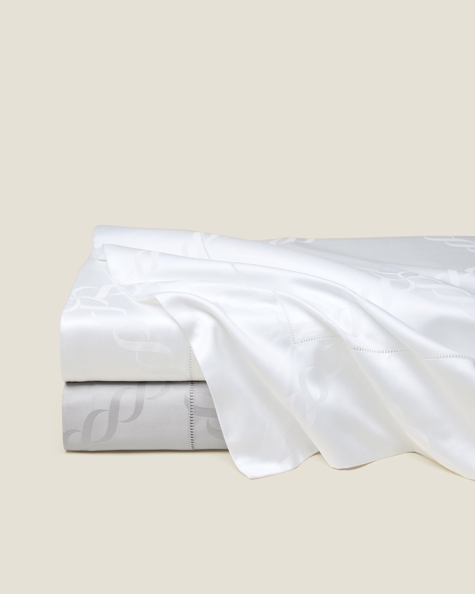 Ori Treccia flat sheet in white and sterling stack