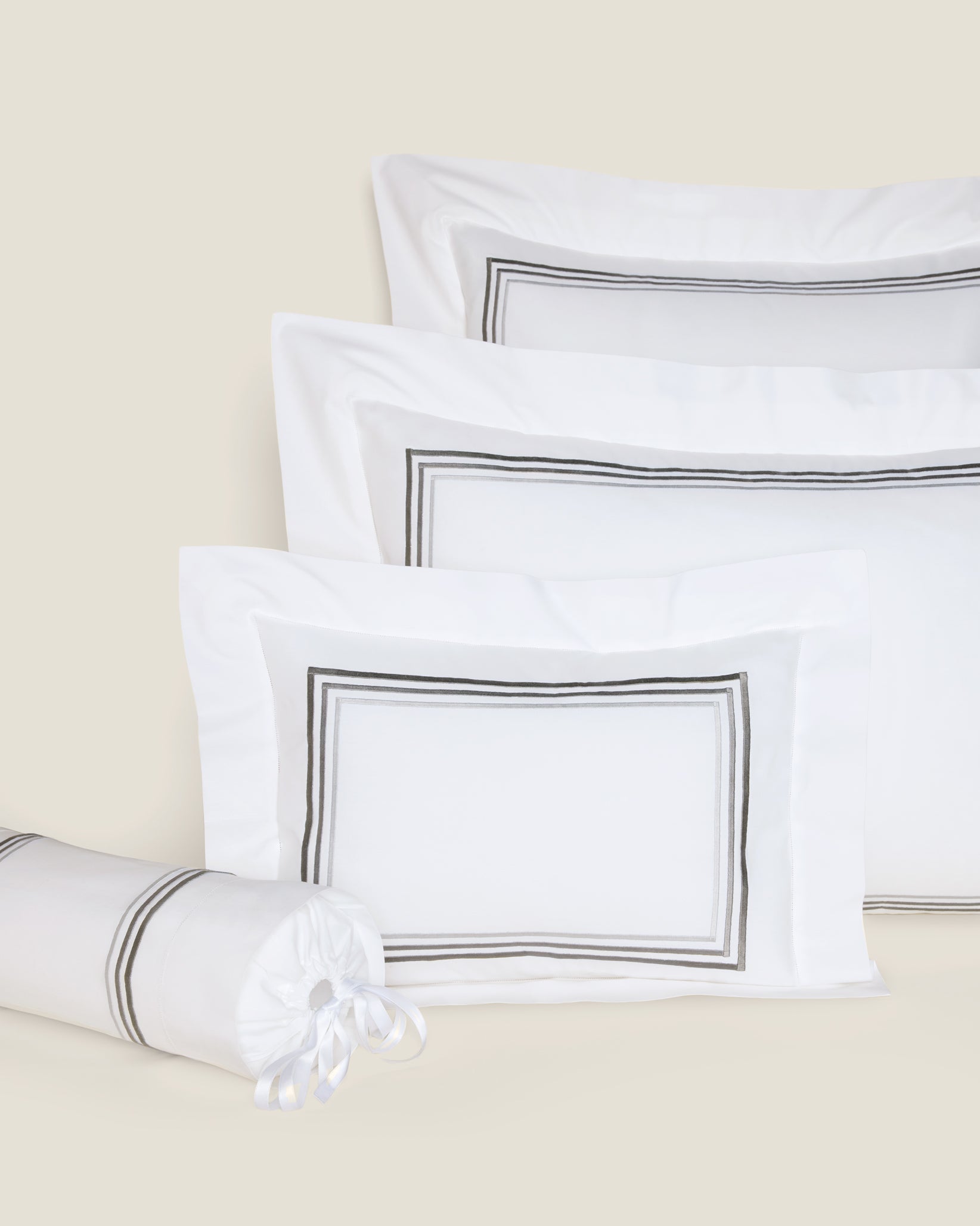 Tre Righe Ombre white/charcoal shams in queen, standard, boudoir and neckroll sizes.