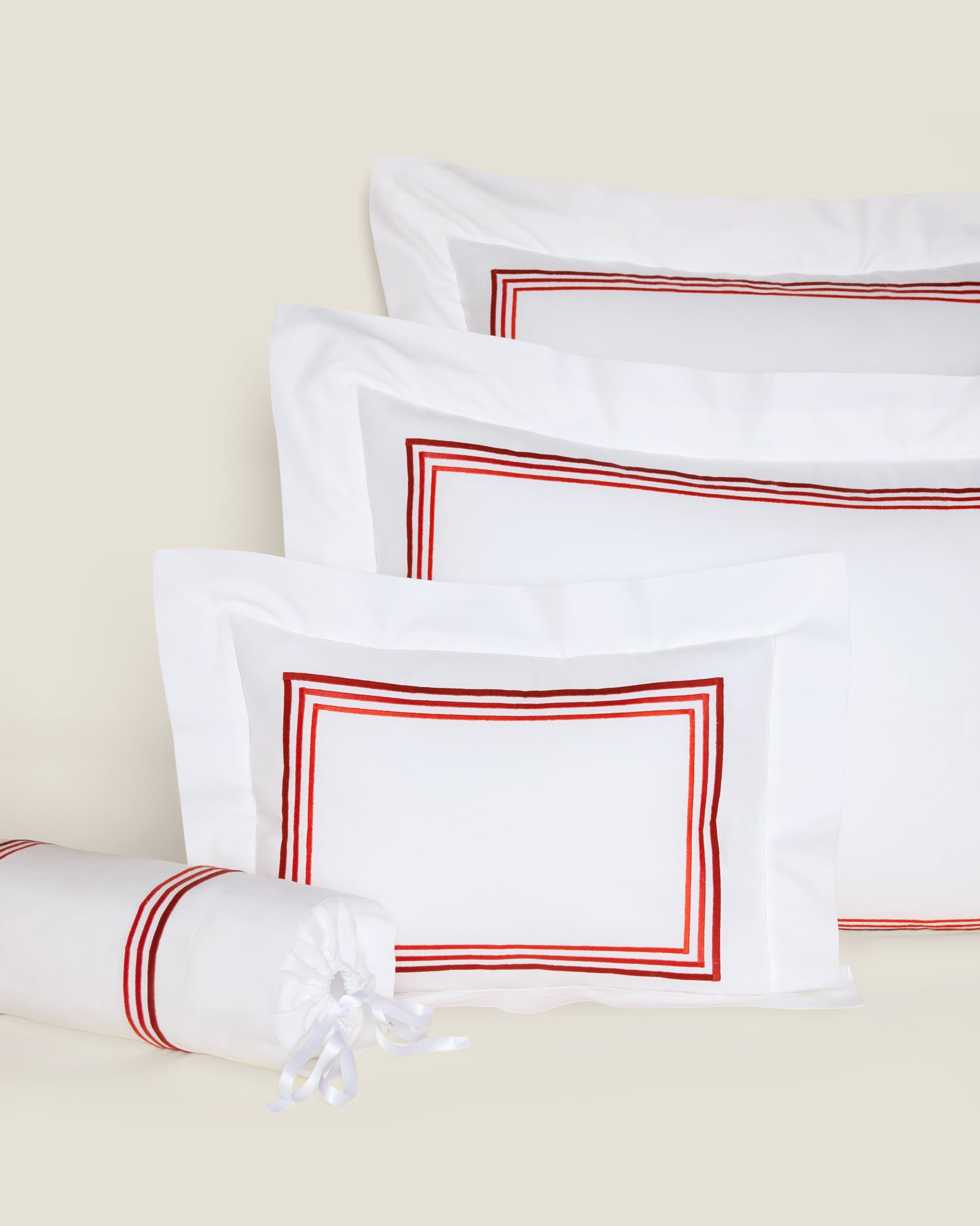 Tre Righe Ombre white/scarlet shams in queen, standard, boudoir and neckroll sizes.